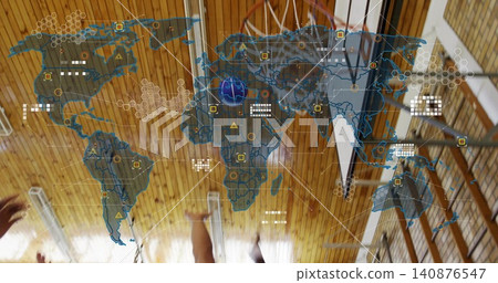 Jumping adult male players in jerseys reaching toward basketball hoop at gymnasium, with AR overlay Jumping adult male players in jerseys reaching toward basketball hoop at gymnasium, with AR overlay 140876547