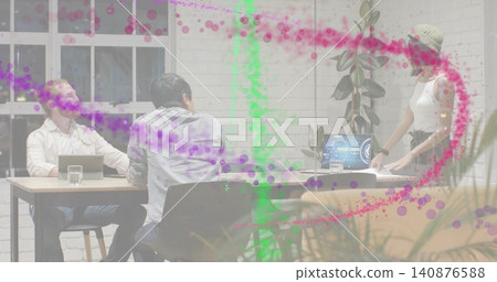 Presenting beanie-clad woman handling papers at office table with laptops and colorful overlay Presenting beanie-clad woman handling papers at office table with laptops and colorful overlay 140876588