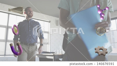 Man in blue shirt khaki pants standing in office with floating AR icons and blue folder Man in blue shirt khaki pants standing in office with floating AR icons and blue folder 140876591
