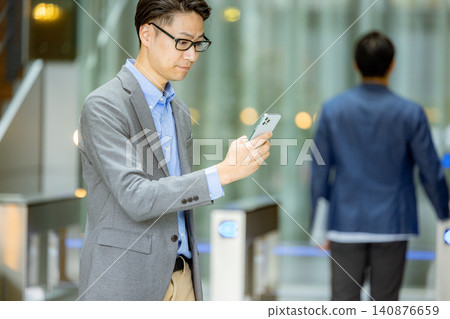 A man with a smartphone A man with a smartphone 140876659