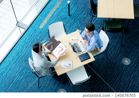 Men in a meeting (overhead view) Men in a meeting (overhead view) 140876703
