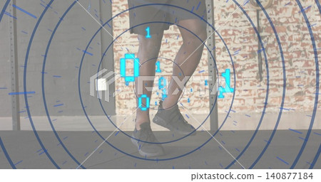 Showing African American male lower legs standing in loft studio with metal table legs, AR rings Showing African American male lower legs standing in loft studio with metal table legs, AR rings 140877184