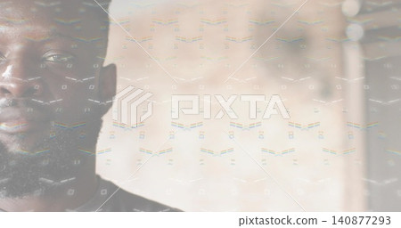 Facing bearded man occupying left frame, wearing dark top with geometric overlay, copy space 140877293