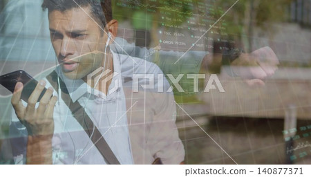 Talking man in white shirt on sidewalk, holding phone near mouth, wired buds, watch, charts overlay Talking man in white shirt on sidewalk, holding phone near mouth, wired buds, watch, charts overlay 140877371
