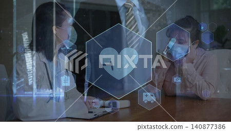 Writing clinician with stethoscope, mask taking notes at clinic table, man in suit observing, HUD Writing clinician with stethoscope, mask taking notes at clinic table, man in suit observing, HUD 140877386