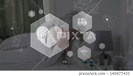 Leaning mature woman wearing light long-sleeve top covering face in bedroom, with nightstand meds Leaning mature woman wearing light long-sleeve top covering face in bedroom, with nightstand meds 140877435