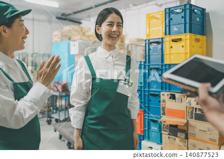 A new part-time employee is praised at the supermarket's morning meeting. A new part-time employee is praised at the supermarket's morning meeting. 140877523