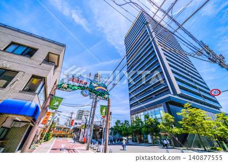 A view of Tokyo, Japan, including Togoshi-Koen Station on the Tokyu Railway line and high-rise apartment buildings. A view of Tokyo, Japan, including Togoshi-Koen Station on the Tokyu Railway line and high-rise apartment buildings. 140877555