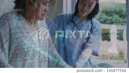 Guiding nurse in blue scrubs holding patient wrist in cardigan by window, stethoscope, overlay Guiding nurse in blue scrubs holding patient wrist in cardigan by window, stethoscope, overlay 140877598