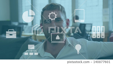 Sitting man in white shirt leaning back on dark sofa at open-plan office, overlay icons Sitting man in white shirt leaning back on dark sofa at open-plan office, overlay icons 140877601