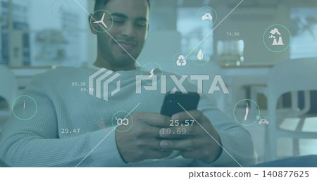 Holding phone, Asian man leaning back, checking AR overlay icons in lounge, light ribbed sweater Holding phone, Asian man leaning back, checking AR overlay icons in lounge, light ribbed sweater 140877625