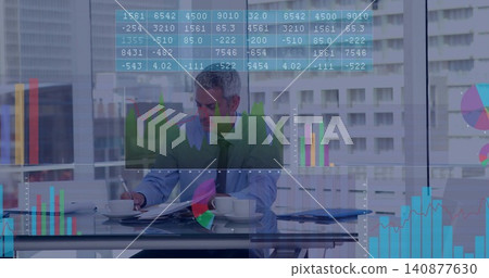 Reviewing man in blue-shirt, dark-tie writing at glass desk in office with cup, folder, data charts Reviewing man in blue-shirt, dark-tie writing at glass desk in office with cup, folder, data charts 140877630