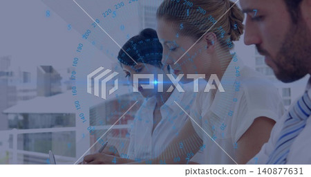 Reviewing papers, three professionals wearing white shirts working in office, with laptop HUD Reviewing papers, three professionals wearing white shirts working in office, with laptop HUD 140877631