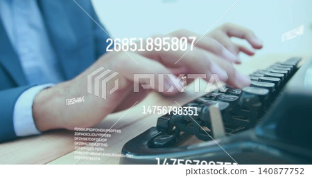 Typing hands in dark suit blue shirt pressing typewriter keys on wood desk, with digital overlays 140877752