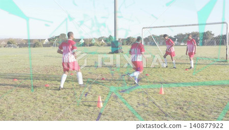 Dribbling four players in red jerseys training near goal on pitch with ball, cones, teal overlay Dribbling four players in red jerseys training near goal on pitch with ball, cones, teal overlay 140877922