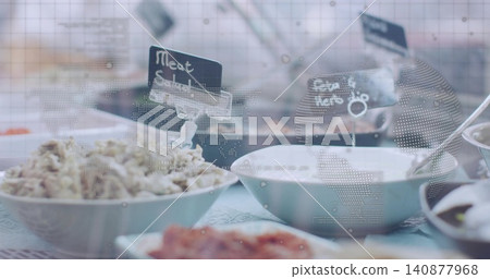 Showing white ceramic bowls sitting on cafe table with patterned cloth, chalk labels and dotted map 140877968