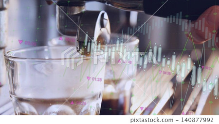 Operating barista hand holding metal portafilter at cafe, with glass of ice and financial graphs 140877992