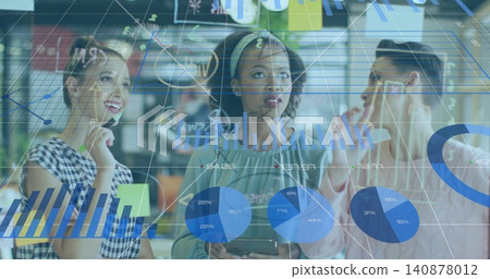 Holding tablet, central woman wearing headband, blouse studying data overlay in office, with charts Holding tablet, central woman wearing headband, blouse studying data overlay in office, with charts 140878012