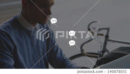 Working man in sweater, using laptop on pier with bike, wired earbuds, bag, chat-icons, copy space Working man in sweater, using laptop on pier with bike, wired earbuds, bag, chat-icons, copy space 140878031