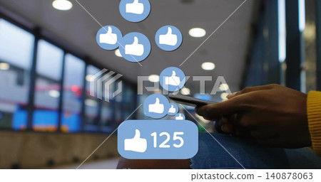 Holding phone, woman in yellow sweater tapping feed at train station, with blue likes, copy space Holding phone, woman in yellow sweater tapping feed at train station, with blue likes, copy space 140878063