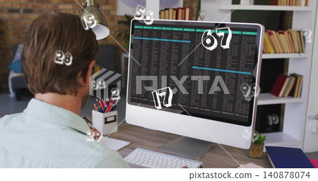 Typing man in shirt, wearing glasses at home desk, checking monitor with white numbers, copy space Typing man in shirt, wearing glasses at home desk, checking monitor with white numbers, copy space 140878074