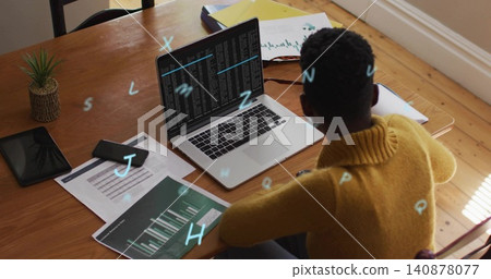 Typing woman wearing yellow sweater coding on laptop at home with bar graphs, copy space Typing woman wearing yellow sweater coding on laptop at home with bar graphs, copy space 140878077
