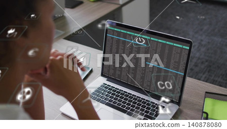 Checking woman in light top scanning laptop terminal, phone, AR icons at office desk, copy space 140878080