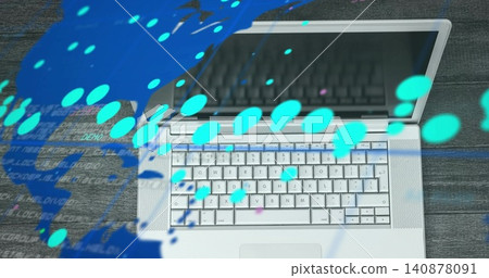 Displaying silver laptop on dark wooden desk, showing keyboard, trackpad, cyan map, code overlays Displaying silver laptop on dark wooden desk, showing keyboard, trackpad, cyan map, code overlays 140878091