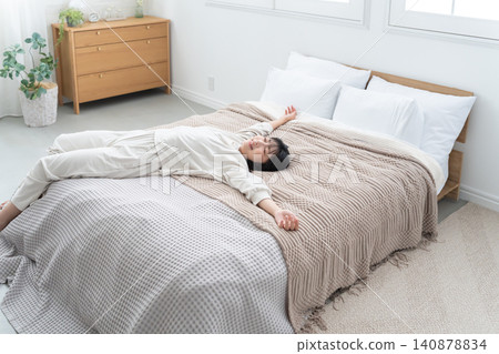 Young woman sleeping in bed Young woman sleeping in bed 140878834
