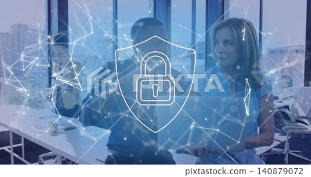 Analyzing three staff in casual wear pointing at laptop at office, showing digital lock overlay Analyzing three staff in casual wear pointing at laptop at office, showing digital lock overlay 140879072