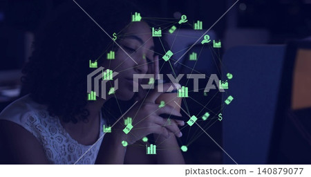 Holding smartphone, woman studying finance overlay in dim office with laptop wearing white lace top Holding smartphone, woman studying finance overlay in dim office with laptop wearing white lace top 140879077