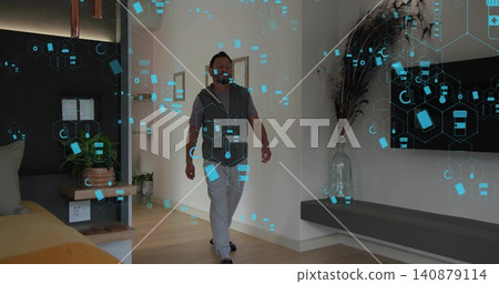 Walking mature Asian man in T-shirt and zip vest through modern living area with AR graphics Walking mature Asian man in T-shirt and zip vest through modern living area with AR graphics 140879114