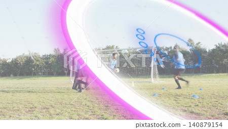 Goalkeeper wearing jersey and gloves holding ball on pitch, players near goal in bibs, pink flare Goalkeeper wearing jersey and gloves holding ball on pitch, players near goal in bibs, pink flare 140879154