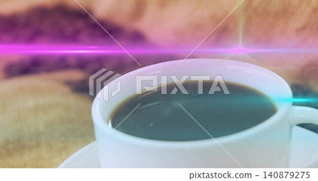 Showing white cup-saucer holding black coffee on table, beans, pink or purple-cyan flares, copy spac Showing white cup-saucer holding black coffee on table, beans, pink or purple-cyan flares, copy spac 140879275