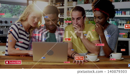 Leaning group of four people gathering around silver laptop at cafe counter with social stickers Leaning group of four people gathering around silver laptop at cafe counter with social stickers 140879303