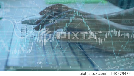 Typing adult female hands pressing laptop keys at desk, in long sleeves showing market charts Typing adult female hands pressing laptop keys at desk, in long sleeves showing market charts 140879474