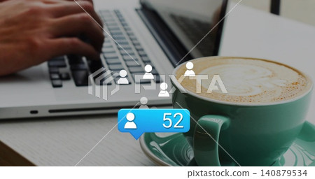 Typing hands hovering over silver laptop at cafe, teal latte cup and '52' notification, copy space Typing hands hovering over silver laptop at cafe, teal latte cup and '52' notification, copy space 140879534