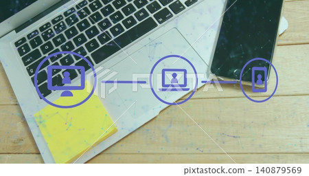 Displaying laptop filling left on wooden desk and showing smartphone, sticky notes, purple overlay 140879569