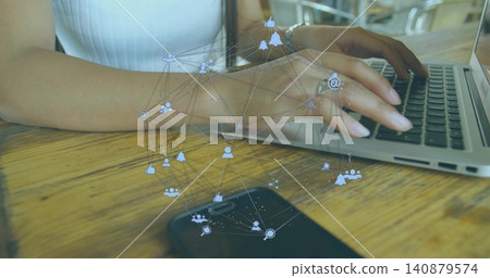 Typing woman wearing sleeveless top at wooden table in cafe, with laptop phone social-icons watch Typing woman wearing sleeveless top at wooden table in cafe, with laptop phone social-icons watch 140879574