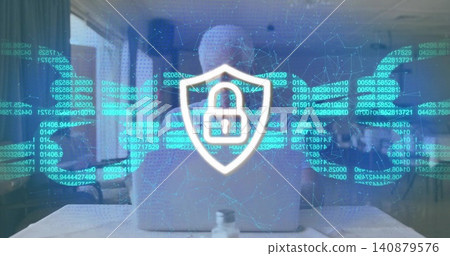 Typing senior man wearing shirt at hotel table with bottle, showing padlock overlay on laptop Typing senior man wearing shirt at hotel table with bottle, showing padlock overlay on laptop 140879576