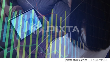 Reviewing two colleagues in business casual holding tablet at office, displaying dashboard charts Reviewing two colleagues in business casual holding tablet at office, displaying dashboard charts 140879585