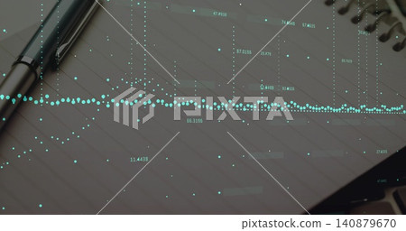 Showing spiral-bound notebook featuring teal data overlay on desk, silver pen, partial laptop Showing spiral-bound notebook featuring teal data overlay on desk, silver pen, partial laptop 140879670