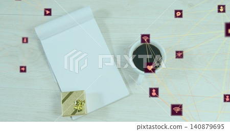 Showing top-bound notepad left on wood desk with gift-box, coffee-mug, purple-icons, yellow-lines 140879695