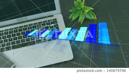 Displaying silver laptop showing blue hologram bar chart at office desk with grid, succulent plant Displaying silver laptop showing blue hologram bar chart at office desk with grid, succulent plant 140879706