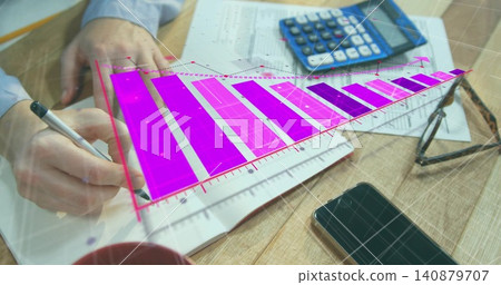 Writing hands with cuff holding ballpoint pen, filling notebook at wooden desk with magenta chart Writing hands with cuff holding ballpoint pen, filling notebook at wooden desk with magenta chart 140879707