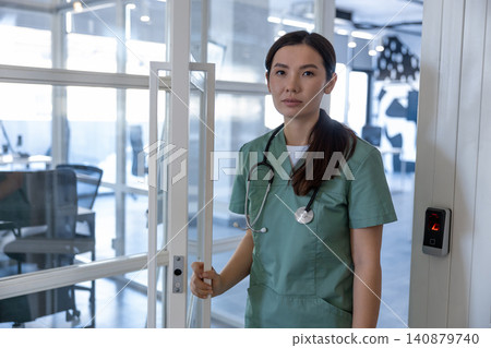 Young female doctor feeling tired after a long shift 140879740