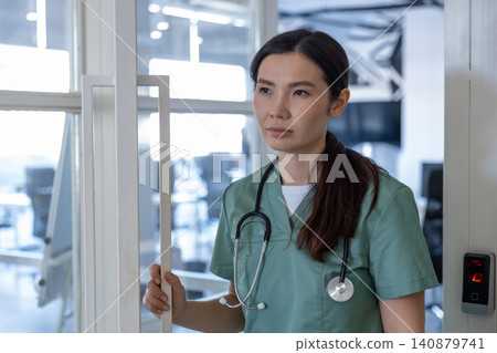 Young female doctor feeling tired after a long shift Young female doctor feeling tired after a long shift 140879741