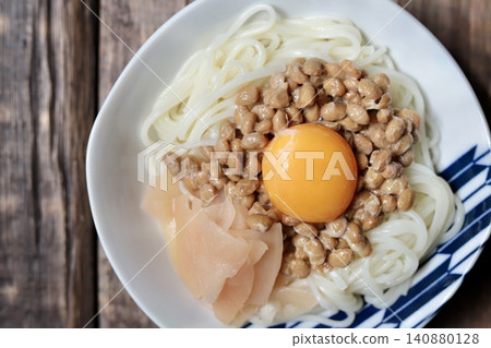 Handa somen noodles with natto and egg topping, served with homemade pickled young ginger. Handa somen noodles with natto and egg topping, served with homemade pickled young ginger. 140880128