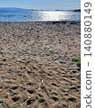 Footprints and driftwood remaining on the sandy beach of Lake Inawashiro Footprints and driftwood remaining on the sandy beach of Lake Inawashiro 140880149
