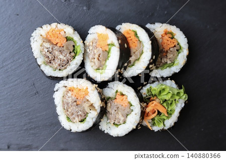 Korean seaweed rolls arranged on a slate plate: bulgogi kimbap Korean seaweed rolls arranged on a slate plate: bulgogi kimbap 140880366
